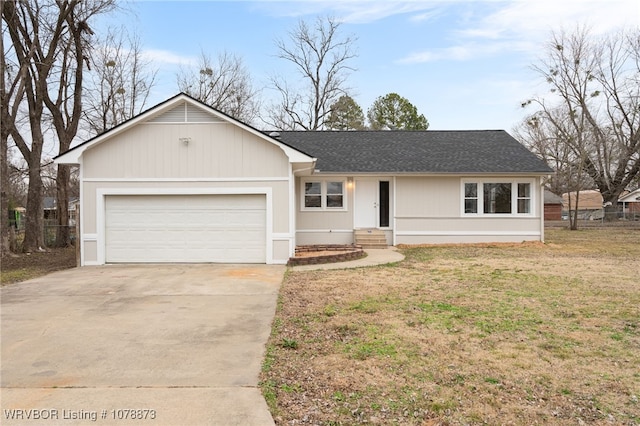 ranch-style house with a garage and a front lawn