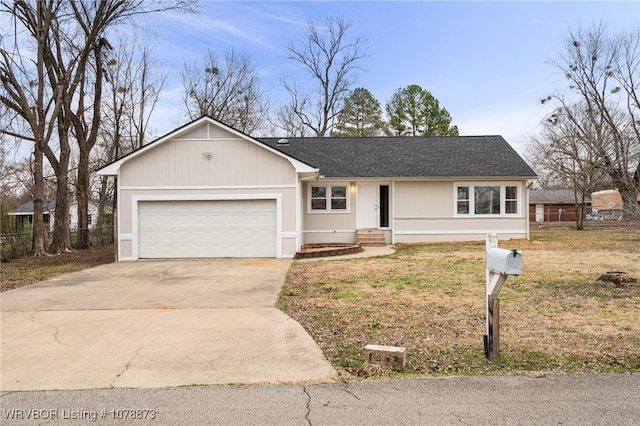 ranch-style home with a garage and a front yard