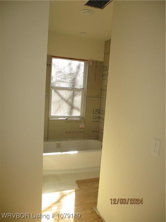 bathroom with wood finished floors