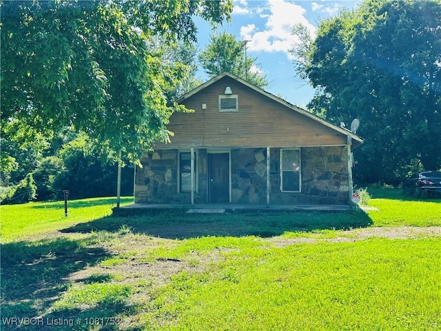 3329 Furry Way, Van Buren, AR 72956 - view of front of home with stone siding, covered porch, and a front yard