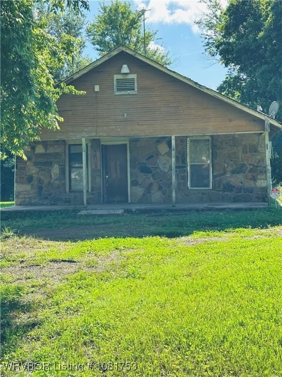 3329 Furry Way, Van Buren, AR 72956 - view of front of property with stone siding, a front yard, and covered porch