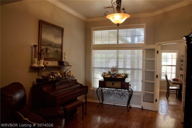 misc room with hardwood / wood-style floors, french doors, and ornamental molding