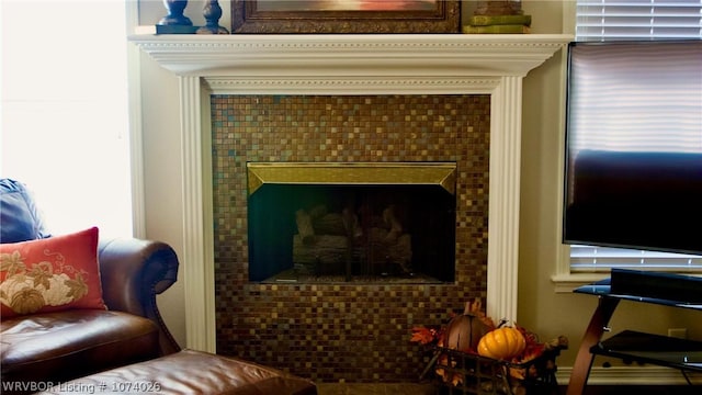 interior space with a tile fireplace