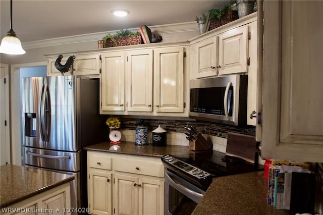 kitchen featuring crown molding, dark stone counters, pendant lighting, decorative backsplash, and appliances with stainless steel finishes