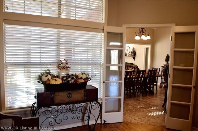 foyer with an inviting chandelier