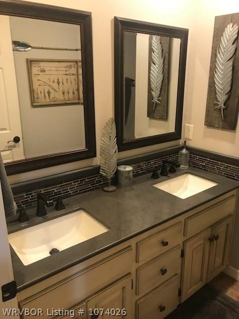 bathroom with tasteful backsplash and vanity