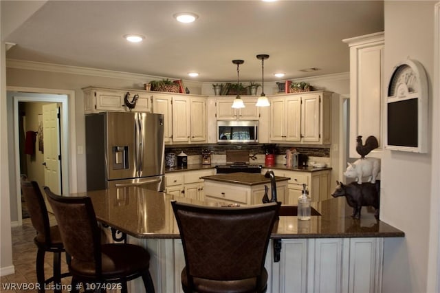 kitchen with decorative backsplash, appliances with stainless steel finishes, kitchen peninsula, crown molding, and pendant lighting