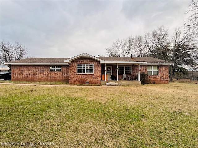 back of property featuring a lawn