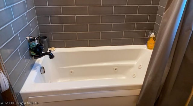 bathroom with a tub