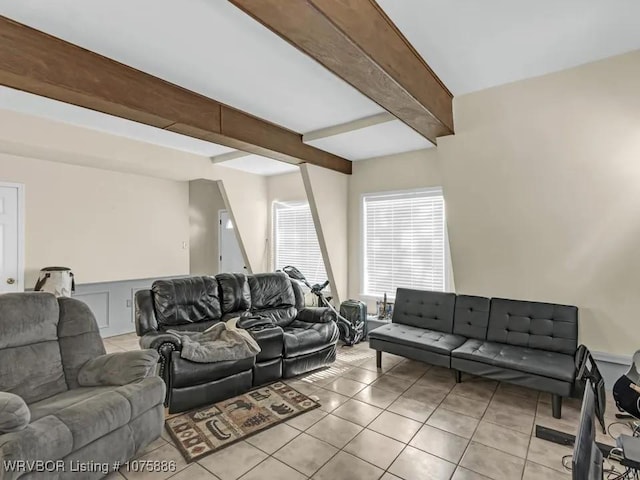 tiled living room featuring beam ceiling