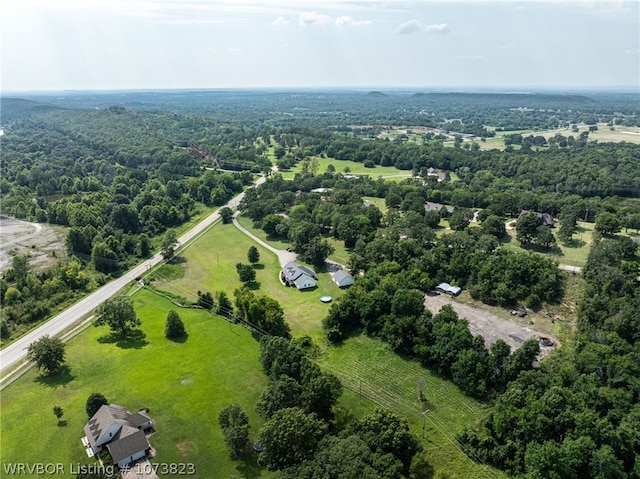 birds eye view of property with a rural view