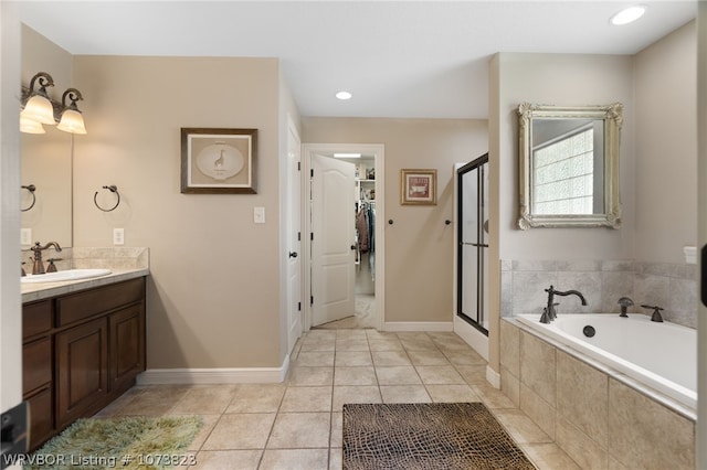 bathroom featuring tile patterned flooring, vanity, and independent shower and bath