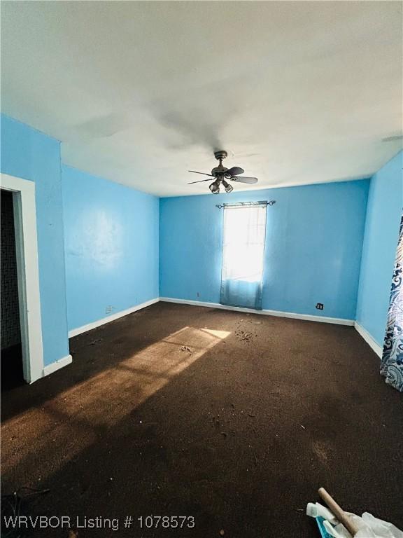 spare room featuring ceiling fan