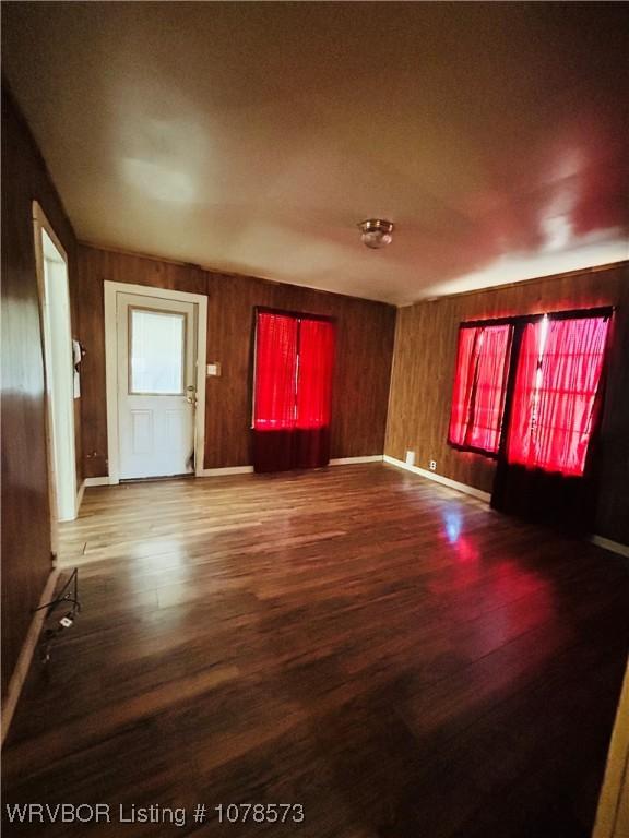 unfurnished living room featuring wood-type flooring