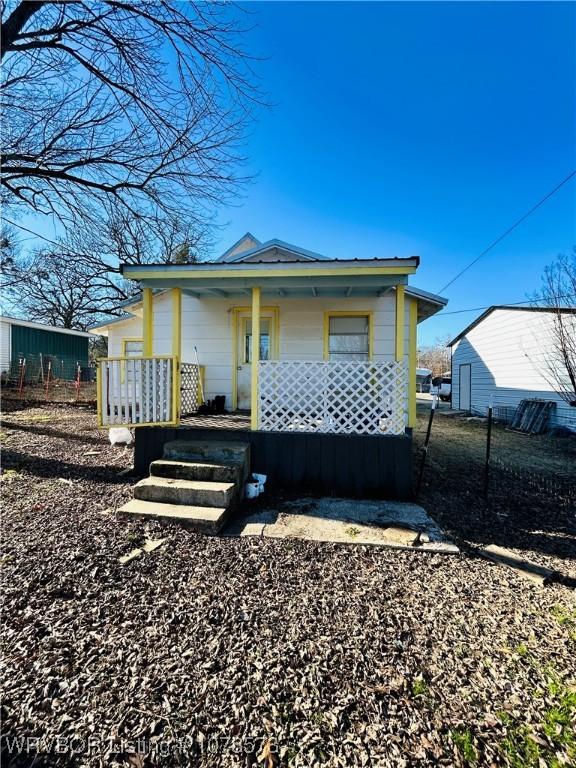 back of house with covered porch