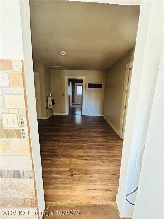 hall with hardwood / wood-style flooring