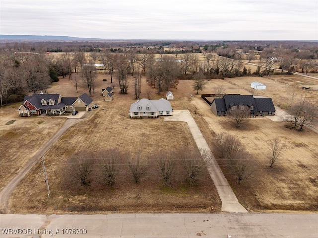 birds eye view of property featuring a rural view