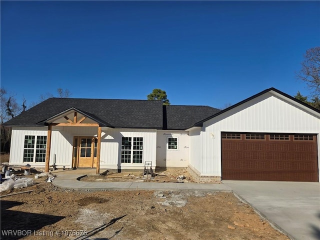 modern farmhouse style home featuring a garage