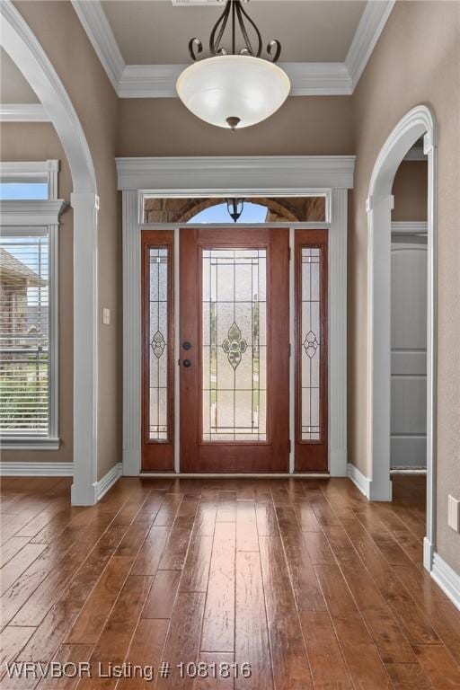 12905 Limestone Dr, Fort Smith, AR 72916 - foyer entrance featuring hardwood / wood-style flooring, arched walkways, and ornamental molding