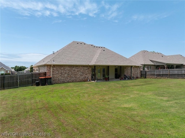 12905 Limestone Dr, Fort Smith, AR 72916 - rear view of property featuring a fenced backyard, a patio, and brick siding