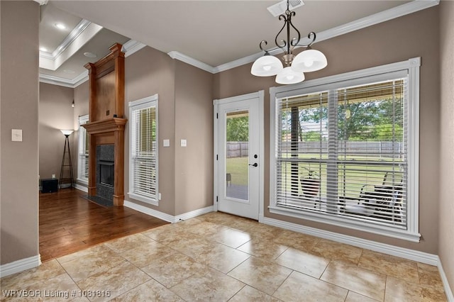12905 Limestone Dr, Fort Smith, AR 72916 - entryway featuring crown molding, a chandelier, a large fireplace, and tile patterned flooring