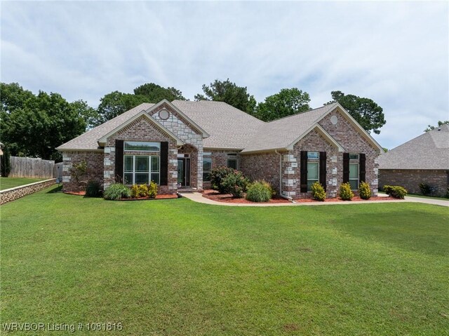 12905 Limestone Dr, Fort Smith, AR 72916 - view of front of property with brick siding, a shingled roof, and stone siding