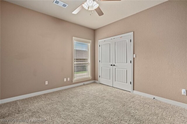 12905 Limestone Dr, Fort Smith, AR 72916 - unfurnished bedroom featuring carpet flooring, a ceiling fan, and a closet