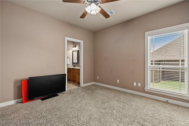 12905 Limestone Dr, Fort Smith, AR 72916 - unfurnished bedroom with light colored carpet, multiple windows, ensuite bathroom, and a ceiling fan