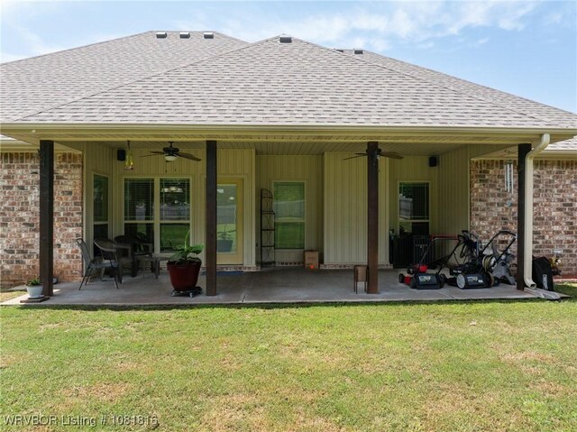 12905 Limestone Dr, Fort Smith, AR 72916 - back of house with ceiling fan, roof with shingles, and a patio
