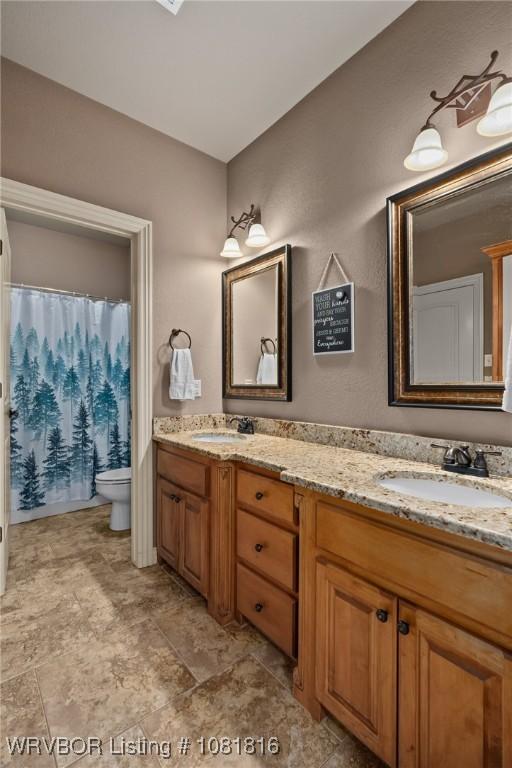 12905 Limestone Dr, Fort Smith, AR 72916 - full bathroom featuring double vanity and a shower with shower curtain