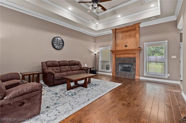 12905 Limestone Dr, Fort Smith, AR 72916 - living area with wood finished floors, a ceiling fan, a high end fireplace, and ornamental molding
