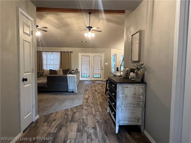 unfurnished bedroom featuring vaulted ceiling with beams and dark hardwood / wood-style floors