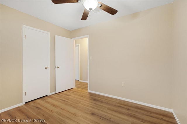 unfurnished bedroom featuring ceiling fan and light hardwood / wood-style floors