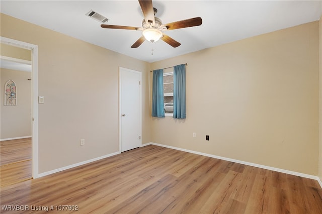 unfurnished room featuring ceiling fan and light hardwood / wood-style floors