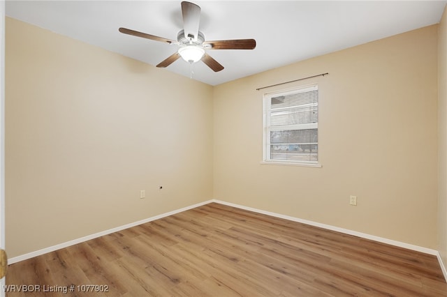 unfurnished room featuring hardwood / wood-style flooring and ceiling fan