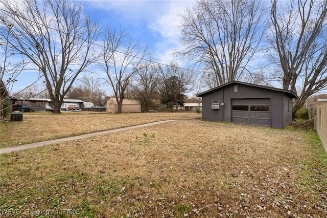 view of yard with an outbuilding and a garage