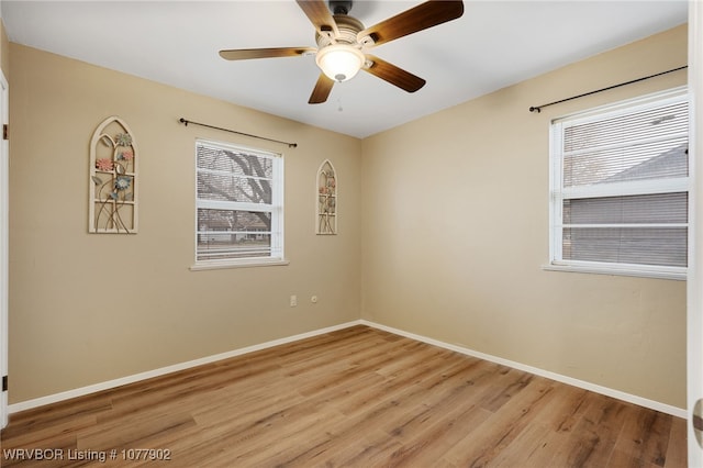 empty room with light hardwood / wood-style floors and ceiling fan