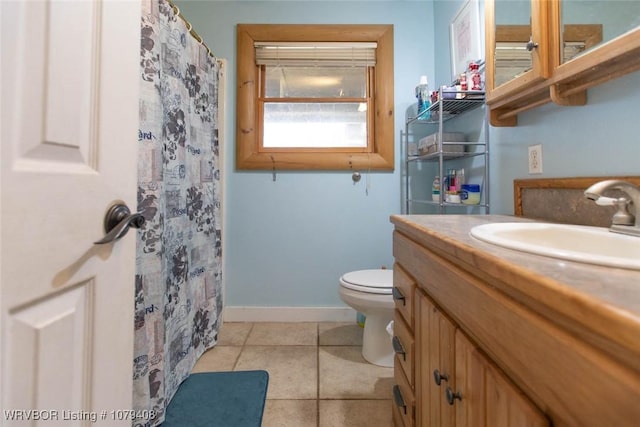 full bathroom with curtained shower, toilet, vanity, tile patterned flooring, and baseboards