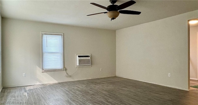 unfurnished room featuring a wealth of natural light, dark hardwood / wood-style flooring, and ceiling fan