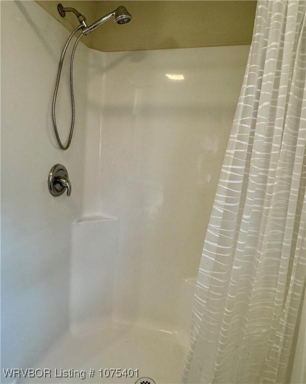 bathroom with a shower with shower curtain