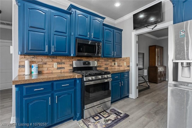 kitchen featuring blue cabinetry, tasteful backsplash, ornamental molding, and stainless steel appliances