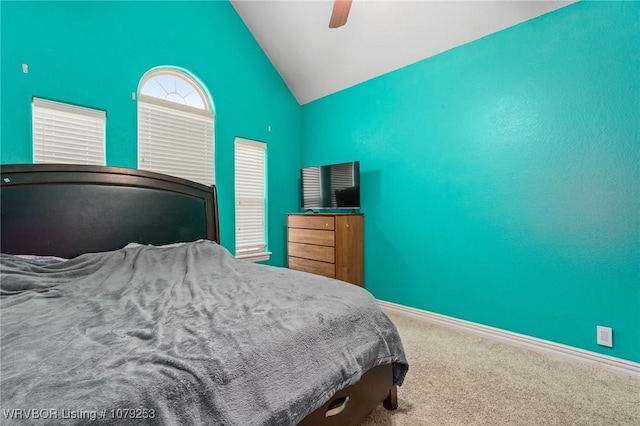 carpeted bedroom featuring a ceiling fan, lofted ceiling, and baseboards