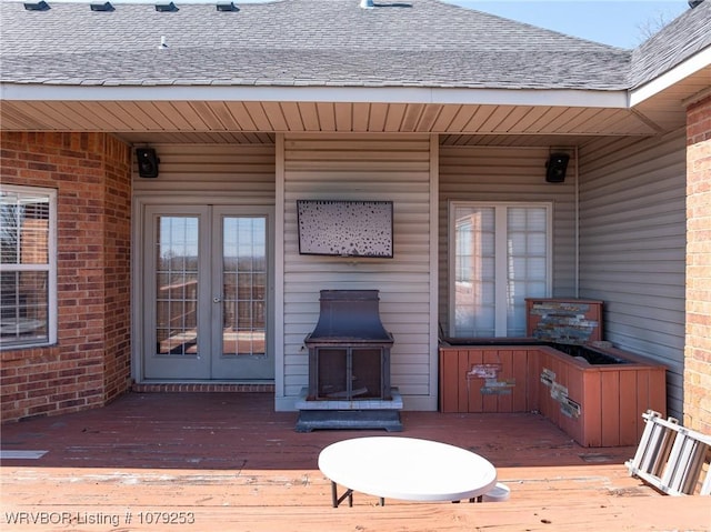 wooden deck featuring french doors