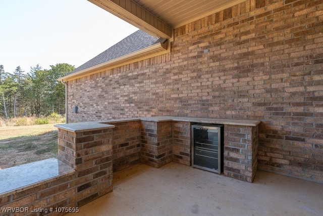 view of patio featuring beverage cooler