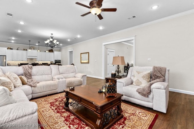 living room featuring ceiling fan with notable chandelier, crown molding, and dark wood-type flooring