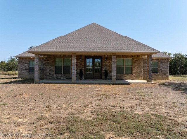 back of house featuring a patio area and french doors