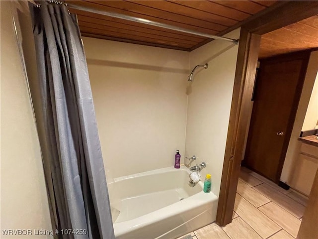 bathroom with shower / bath combo with shower curtain and wooden ceiling