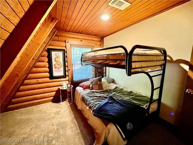 bedroom featuring carpet, log walls, and wooden ceiling