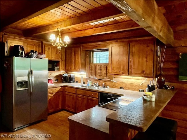 kitchen featuring sink, beamed ceiling, a notable chandelier, kitchen peninsula, and stainless steel fridge