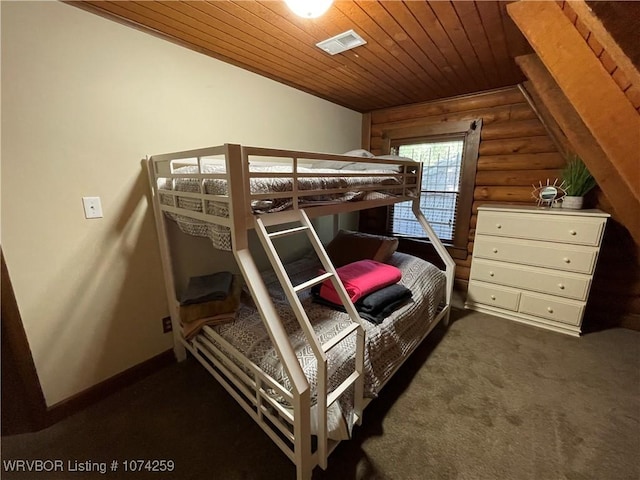 bedroom with log walls, wood ceiling, and dark carpet